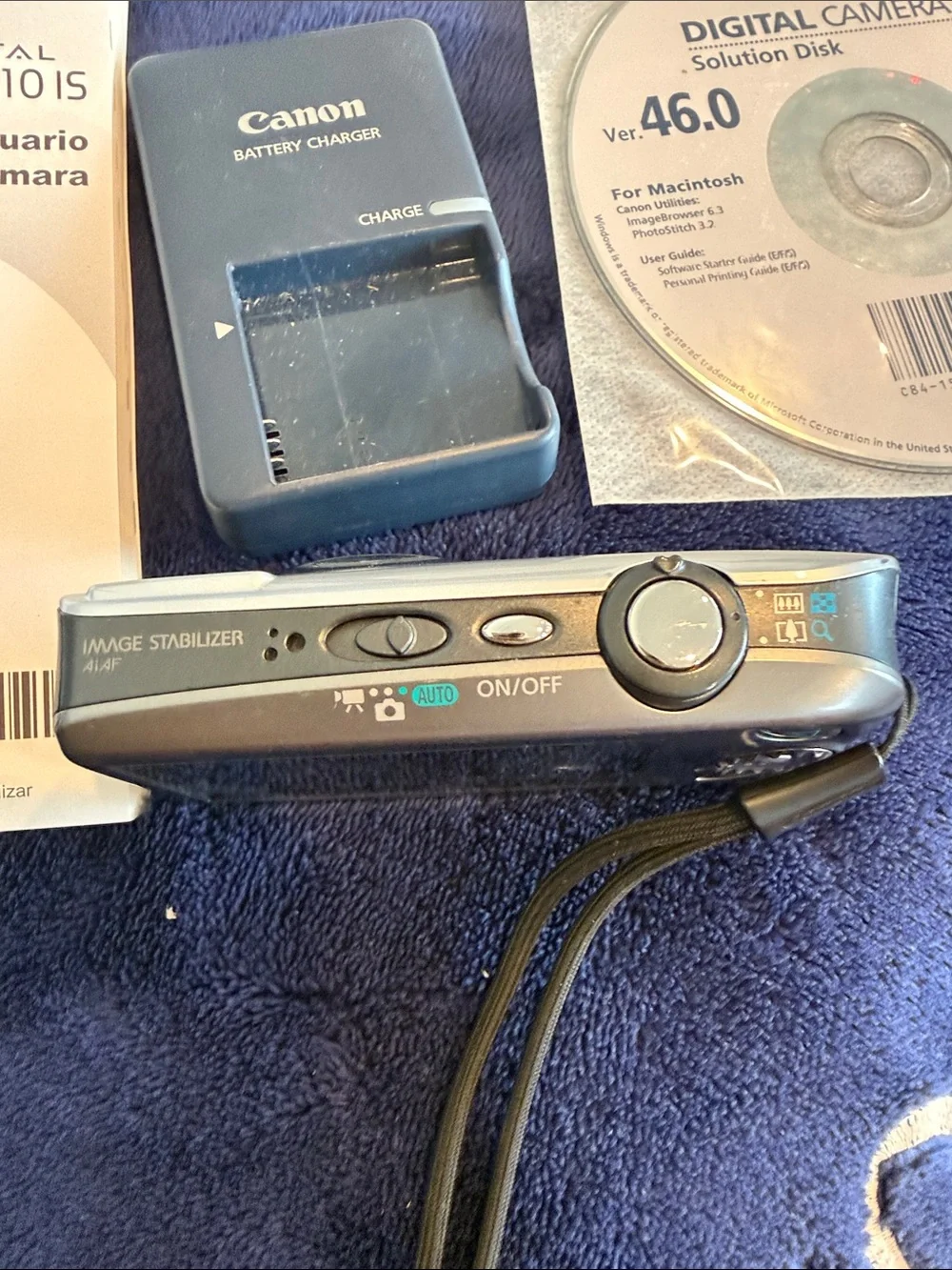 Canon Silver Compact Digital Camera with Manuals & Charger